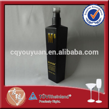 Machine blown 500ml black glass bottle of absolut vodka