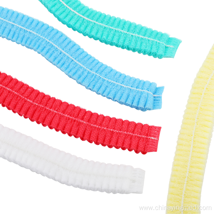 Disposable nonwoven bouffant clip cap