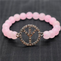 Pulsera de piedras preciosas elástica de cuentas redondas de cuarzo rosa de 8 mm con el logotipo de Diamante Peace. Pieza