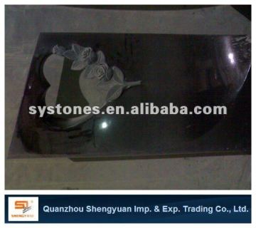 black carved rose headstone