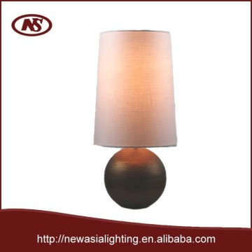 Table lamp with metal sphere base and linen fabric shade