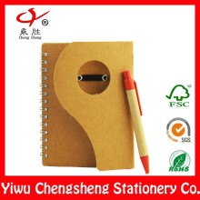 Die cut custom recycled kraft notebook with pen attached