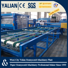 Paper honeycomb core and sandwich wallboard machine