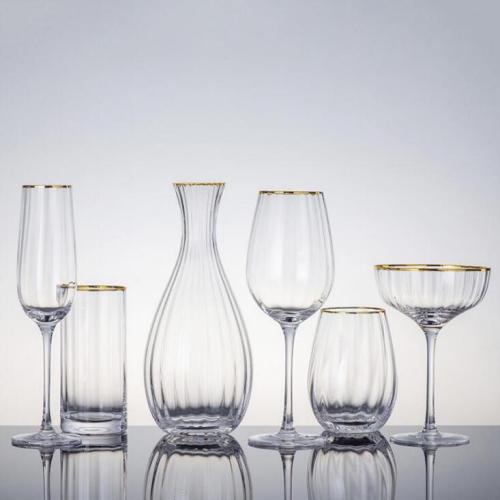 Ribbed design glass drinking set with gold rim