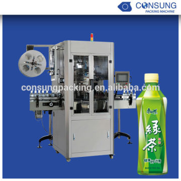 Sleeve labeling machine with shrink tunnel