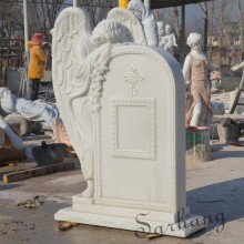 White marble funeral weeping angel tombstone with angle