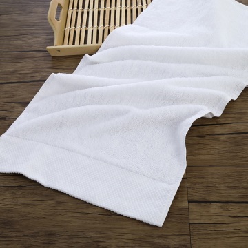Soft white towel for beach vacations