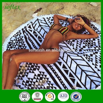 A Remarkably woven 480gsm circular weighted round beach towel with tassels