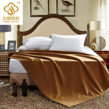 camel colored hotel blanket