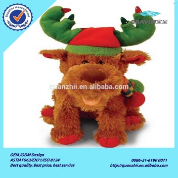 Lovely stuffed Christmas plush dog wearing a red hat