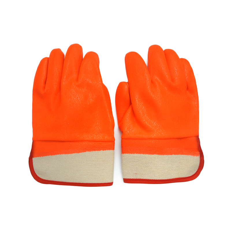 Fluoreszierender orange. Kalter PVC-beschichteter Handschuh