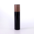 Matte black glass lotion bottle with wooden cap