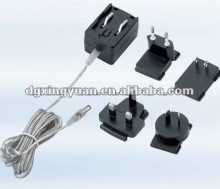 ITE power supplies with interchangeable plugs