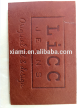 new arrival debossed special words top layer beanie with leather label