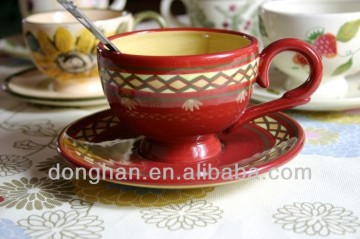 red decal porcelain cup and saucer with spoon