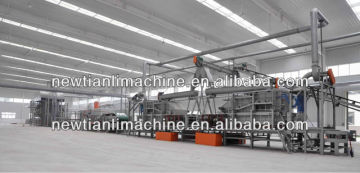 Particle board producing machine
