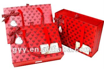 red ribbon bag with tag