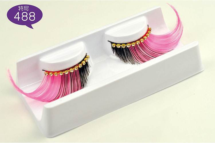 Exaggerated false eyelashes with diamond for show