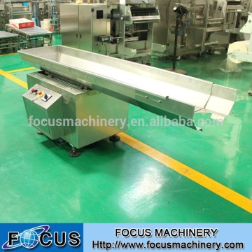 Quick return type motion conveyor feeder