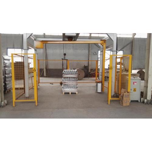 Rotary-arm conveyor pallet wrapper