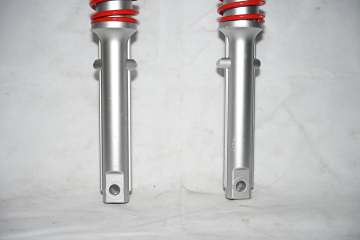 Electric tricycle external spring shock absorber