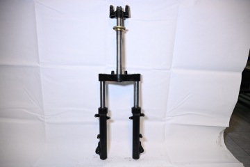 Fully enclosed side mount shock absorber