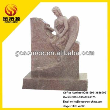 granite headstone with angel sculpture