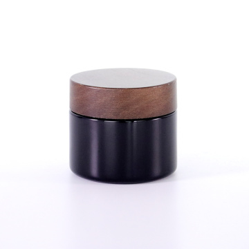 Black frosted glass cream jar with wooden cap