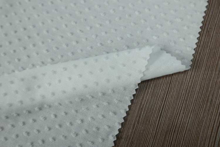 White stretch super soft jacquard clip swiss minky dot fabric