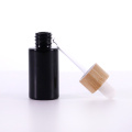 Black flat shoulder glass essential oil bottle