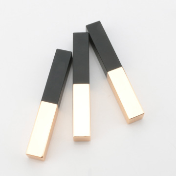 Square black and golden lipstick tube