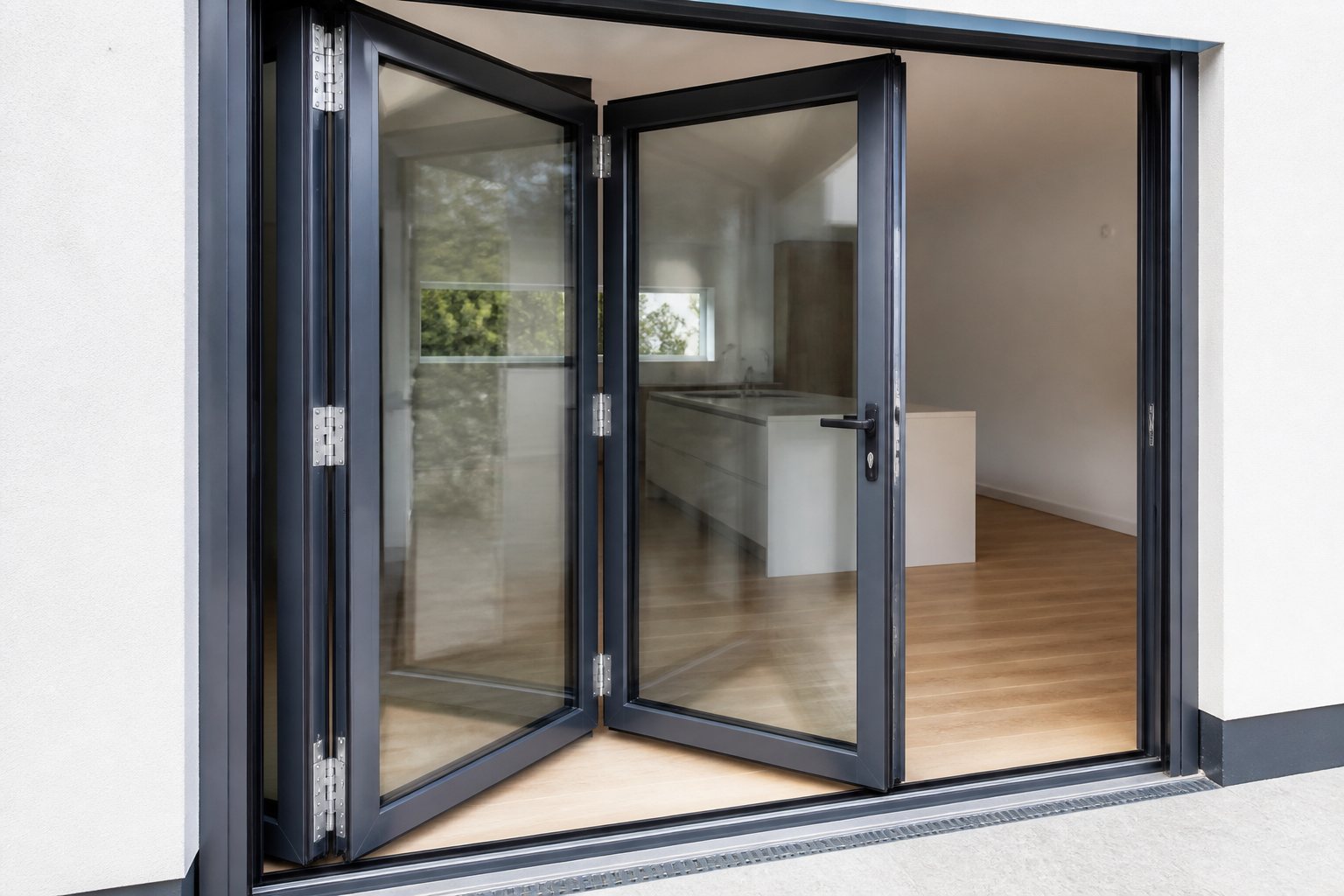 Three-panel trifold door hinges, meeting stiles and bottom track Close view of three aluminium trifold door leaves with hinges, seals and sill track