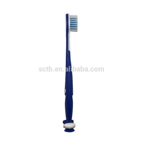 Brosse à dents enfant de bébé de poils doux heureux visage avec ventouse