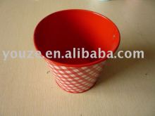 Round red metal bucket