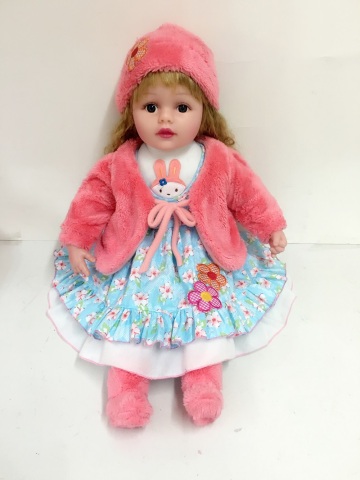 22" pink coat vinyl doll