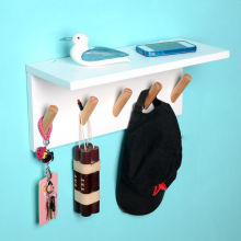 Decorative wooden wall shelf with hooks