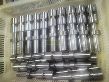 Tractor crane component machining spool and parts