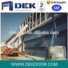 Electrically operated heavy duty steel guillotine door