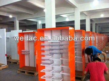 Cosmetic shop display stand with pushers