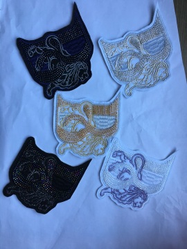 Bead embroidered garment embroidered with glue patch