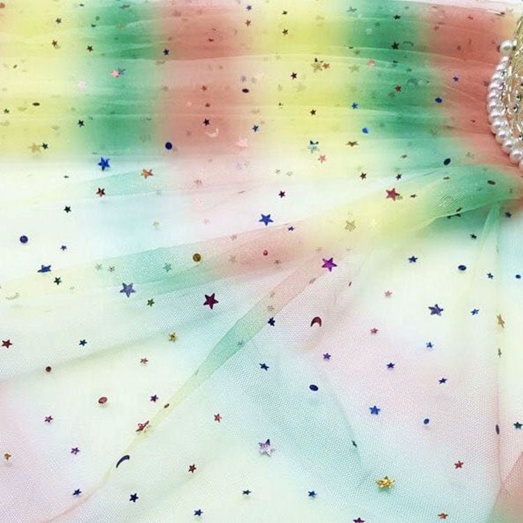 Tessuto per abito in garza a rete con paillettes arcobaleno glitterato in tulle