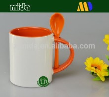 Inside orange color Mug with spoons