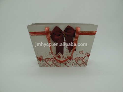 Hot whosale luxury paper bag with red ribbon