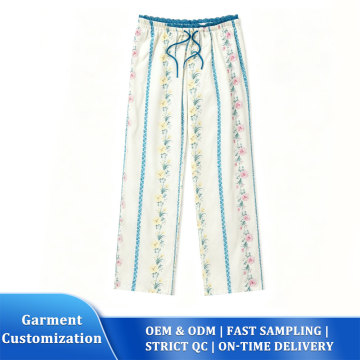 Cremefarbene Lounge-Hose mit floraler Spitze