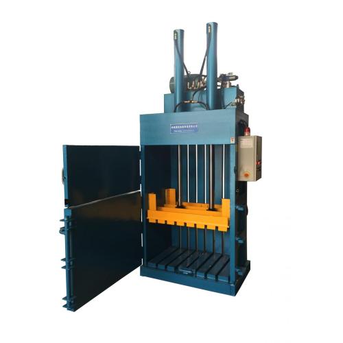 Vertical hydraulic baling machine for waste paper