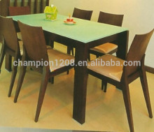 Wooden dinning table set with glass top