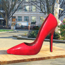 Large outdoor garden red stainless steel high heel shoe sculpture