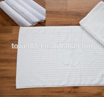 white cotton logo hotel bath mat