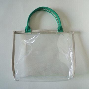 Weiße Kosmetiktasche, hergestellt aus PVC, mit grünen Griff, erhältlich in verschiedenen Farben