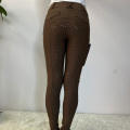 Bruine vrouwelijke paardenspiegel leggings broek